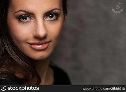 Young brunette woman with beautiful smile