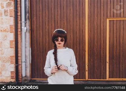 Young brunette woman with retro and hippy style