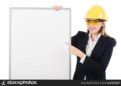 Young builder woman with blank board isolated on white