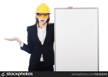Young builder woman with blank board isolated on white