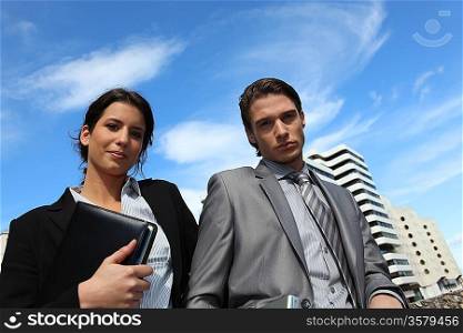 Young business couple in the city