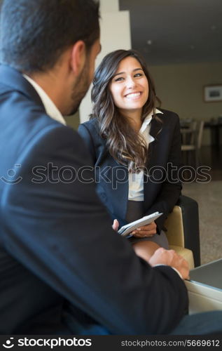 Young business couple meeting with digital tablet