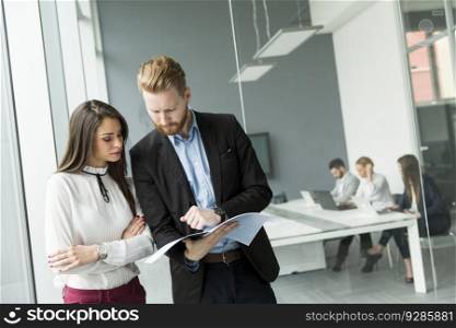 Young business couple working in the office