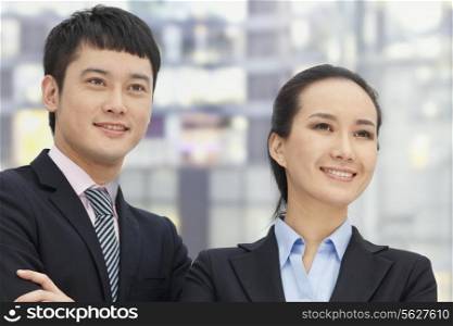 Young business man and woman, portrait