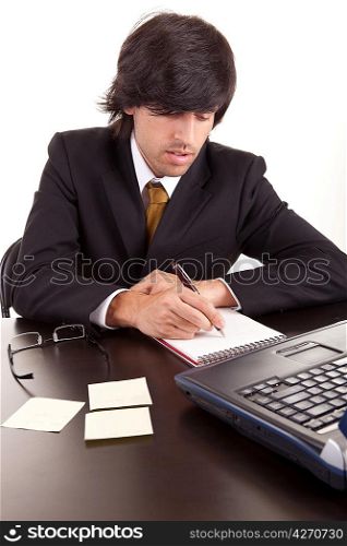 Young business man at work, isolated over white