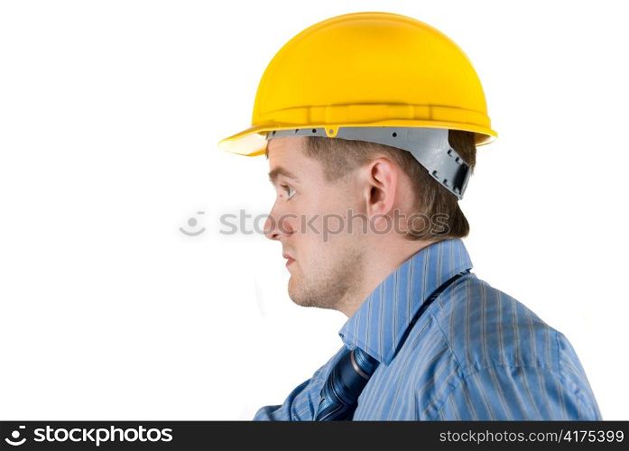 Young business man at yellow helmet isolated on white