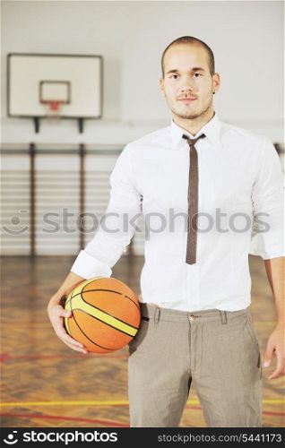 young business man basket player hold basketball ball and representing success and retirement in sport like also sports management concept