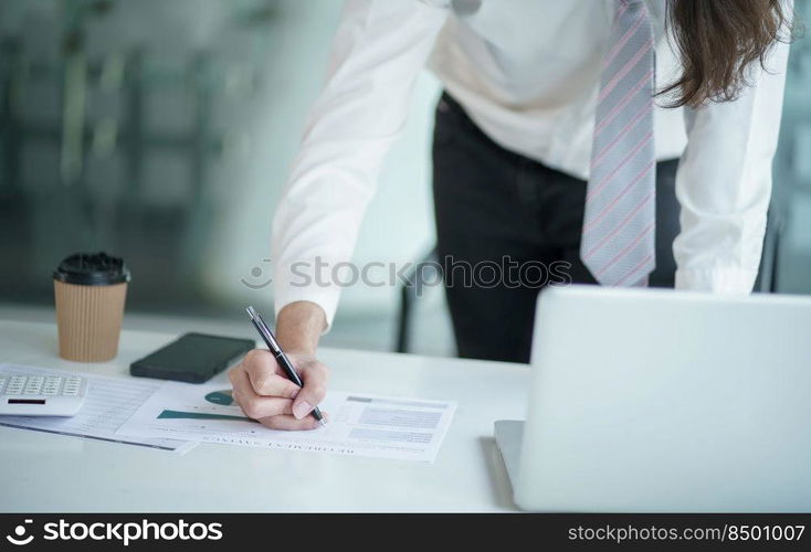 Young business man busy working at office. businessman doing financial paperwork business management 