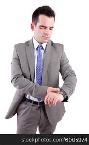 Young business man consulting his watch, isolated over white