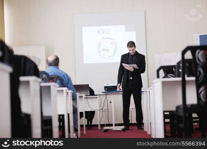 young business man giving presentation and education leassons on seminar event in small bright conference room