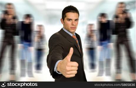 young business man going thumb up