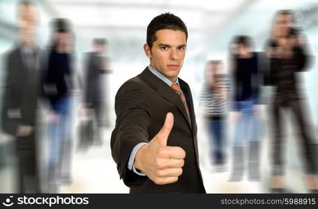 young business man going thumb up