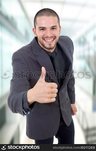 young business man going thumb up