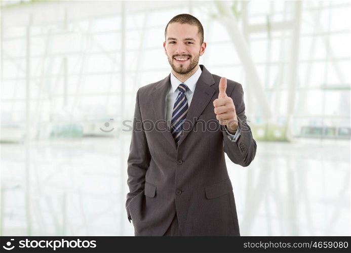 young business man going thumb up, at the office