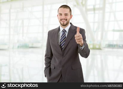 young business man going thumb up, at the office