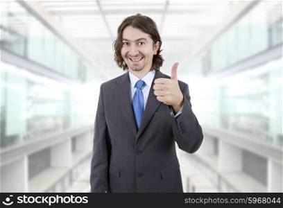 young business man going thumb up at the office