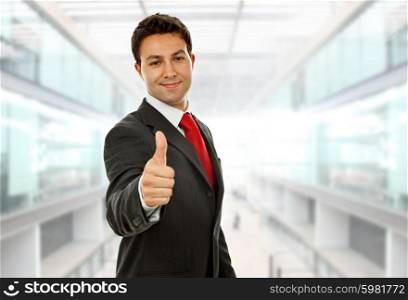 young business man going thumb up at the office