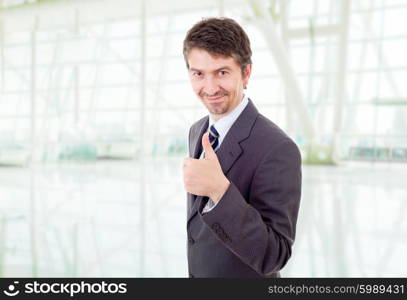 young business man going thumb up, at the office