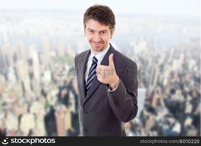 young business man going thumb up, at the office