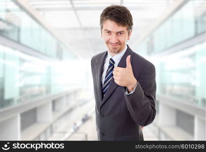 young business man going thumb up, at the office