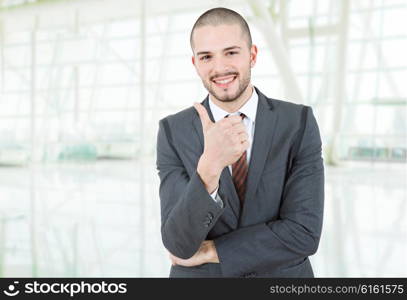 young business man going thumb up, at the office