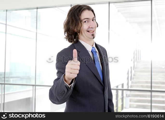 young business man going thumb up at the office