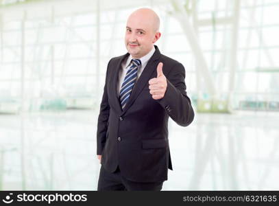 young business man going thumb up, at the office