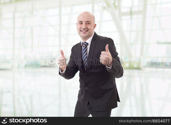 young business man going thumb up, at the office