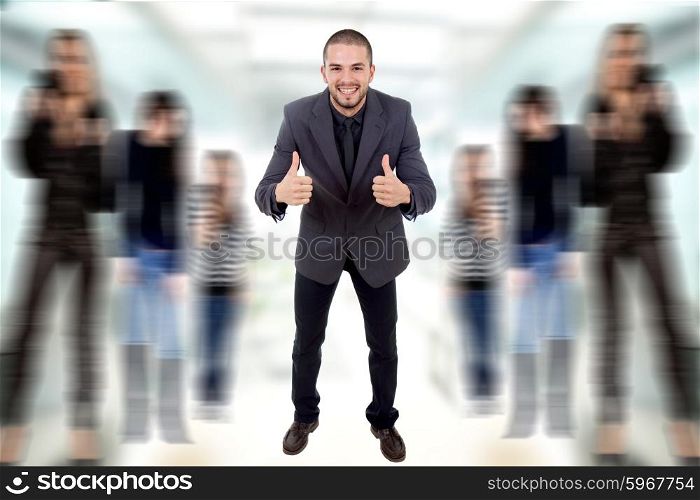 young business man going thumbs up