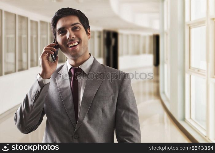 Young business man having conversation on call