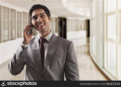 Young business man having conversation on call
