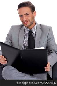 Young business man holding a blank paper on a clip board over white background