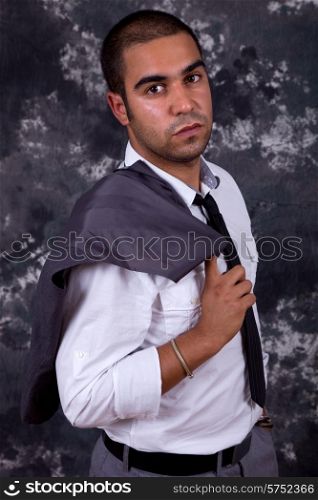 young business man, in front of a dark background
