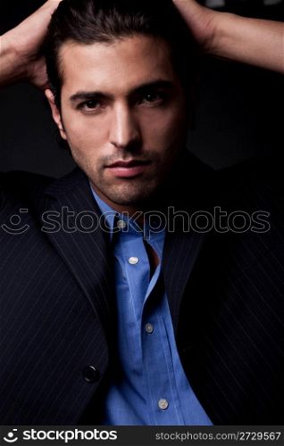 young business man in isolated black backround