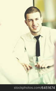 young business man lawyer with laptop alone in big bright conference room