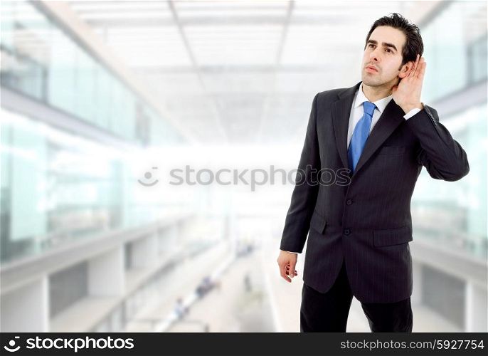 young business man listening at the office