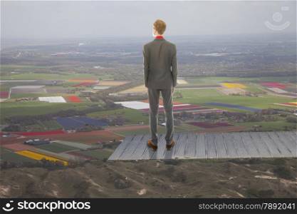Young business man looking at landscape