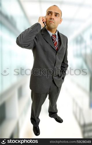 young business man looking with his phone