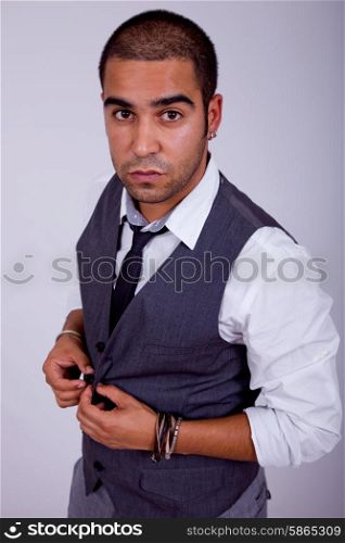 young business man pensive, on a grey background