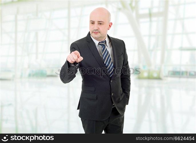 young business man pointing, at the office