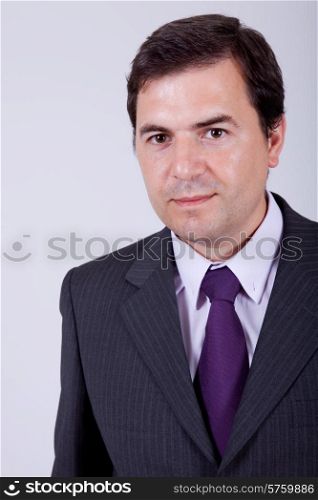 young business man portrait on a grey background