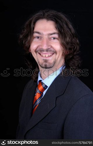young business man portrait on black background