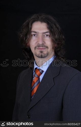 young business man portrait on black background