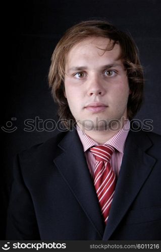 young business man portrait on black background&#xA;