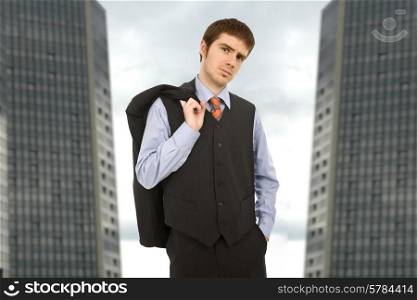 young business man portrait with office buildings in the background