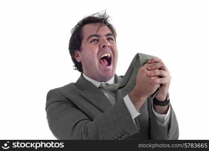 young business man screaming and pulling his tie