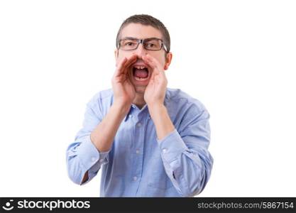 Young business man screaming at you, isolated over white background