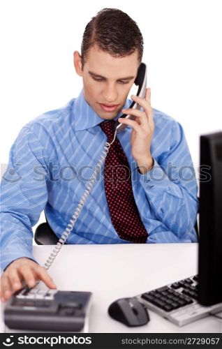 young business man sitting at his desk talking over phone on isolated white background