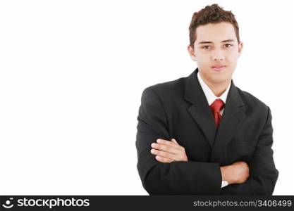 Young business man standing against the wall with crossed arms
