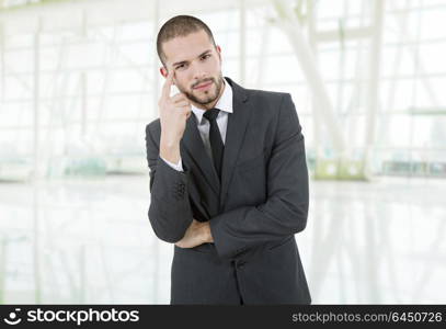 young business man thinking, at the office